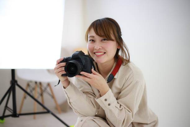 Smile female cameraman stock photo