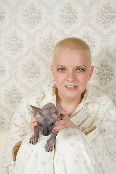 smiling blond woman with cat stock photo