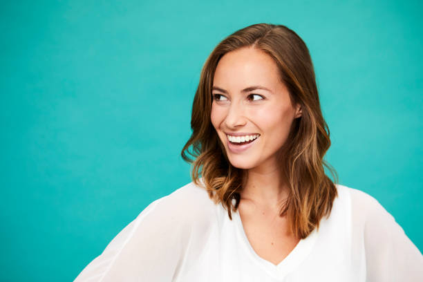Smiling brunette in studio stock photo