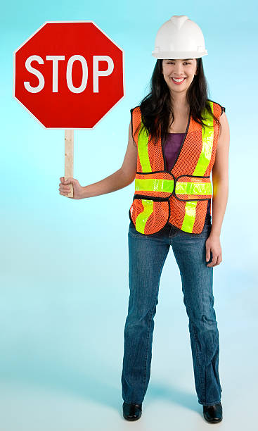 Smiling Conceptual Construction Lady Worker Stopping you For Something stock photo