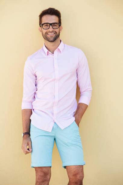 Smiling dude in pink stock photo