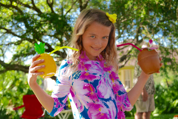 Smiling girl dressed up at a Hawaiian Luau stock photo