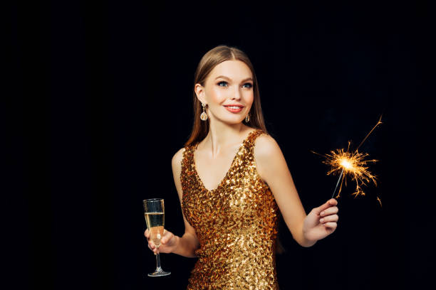 Smiling girl with Christmas sparkler Smiling girl with Christmas sparkler new years eve girl stock pictures, royalty-free photos & images