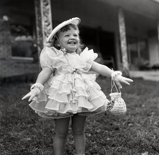 Smiling Little Girl in Fancy Ruffle Dress stock photo