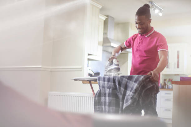 Man Ironing Stock Photos, Pictures & Royalty-Free Images - iStock