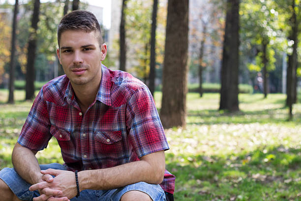 Smiling man Smiling young man portrait in the park 20 29 years stock pictures, royalty-free photos & images