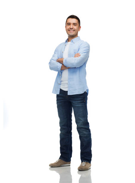 smiling man with crossed arms happiness and people concept - smiling man with crossed arms full length stock pictures, royalty-free photos & images