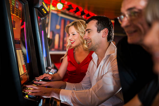 511 Group Of People Playing Slots In Casino. Stock Photos, Pictures &amp;  Royalty-Free Images - iStock