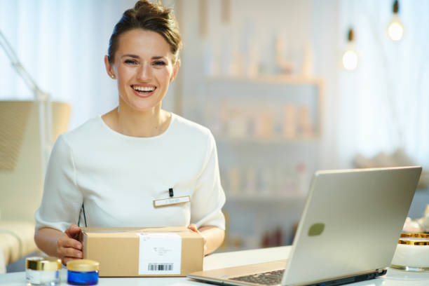 smiling woman employee in modern beauty studio stock photo