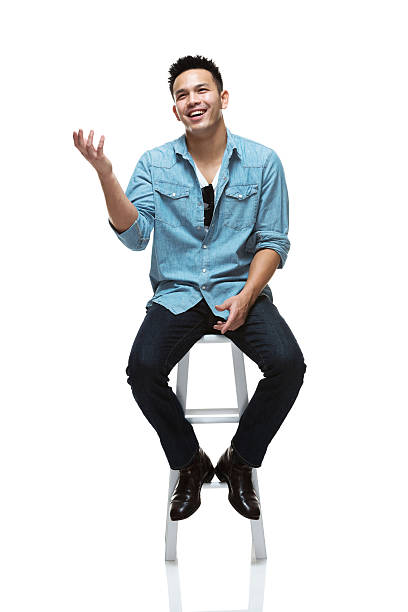 Smiling young man Smiling young manhttp://www.twodozendesign.info/i/1.png stool stock pictures, royalty-free photos & images