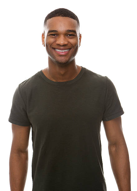 Smiling young man with green t-shirt stock photo