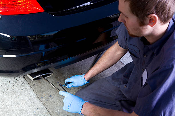 Smog Testing Mechanic smog testing car. CLICK TO SEE MORE! smog stock pictures, royalty-free photos & images