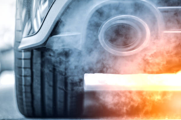 Smoke emission from powerfull SUV car with exhaust pipe stock photo