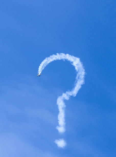 Smoke in the shape of a question mark plane made stock photo