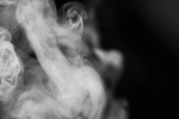 Smoke On Black Background Close-Up A close-up shot of smoke on a black background. wispy stock pictures, royalty-free photos & images