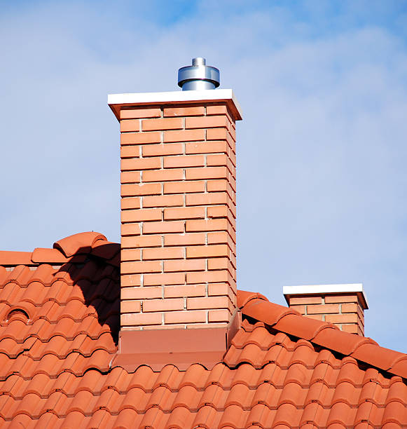 smoke stacks on the tiled roof smoke stacks on the tiled roof chimney stock pictures, royalty-free photos & images