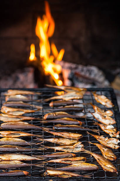 Smoked fish and fire stock photo