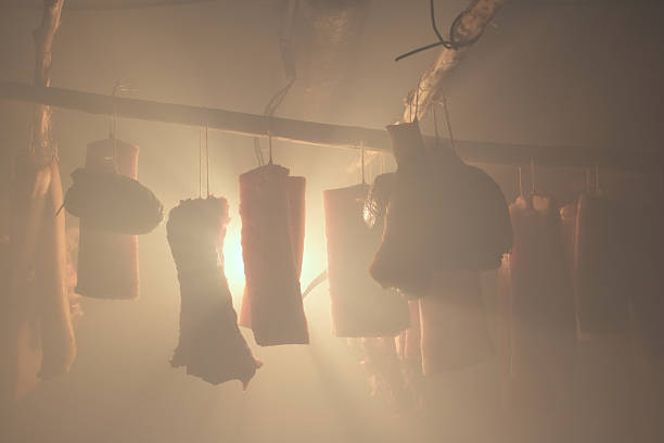 Smoked sausages, ham, bacon, ribs in the smokehouse. stock photo