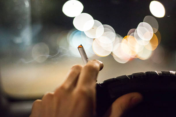 Smoking Cigarette in Car stock photo