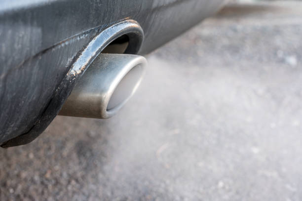 Smoking exhaust from a car smoking exhaust in close-up exhaust pipe stock pictures, royalty-free photos & images