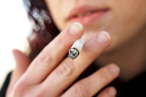 Smoking Female Mouth stock photo