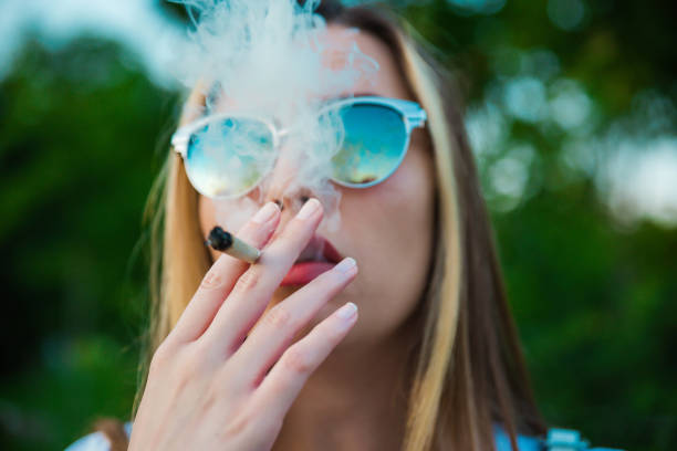Smoking marijuana Smoking marijuana marijuana joint stock pictures, royalty-free photos & images