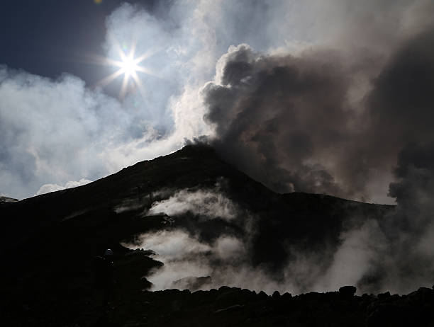 Smoking Mount Etna volcano stock photo
