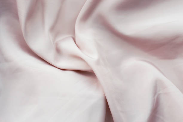 Smooth, elegant powdery silk. Satin fabric with stitching. Retro style stock photo