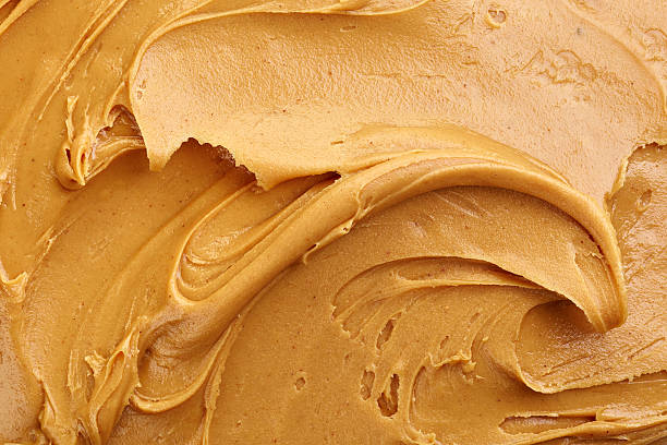 Smooth peanut butter smeared all over stock photo