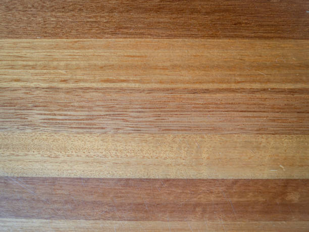 Smooth wooden surface with visible grain and striped effect stock photo