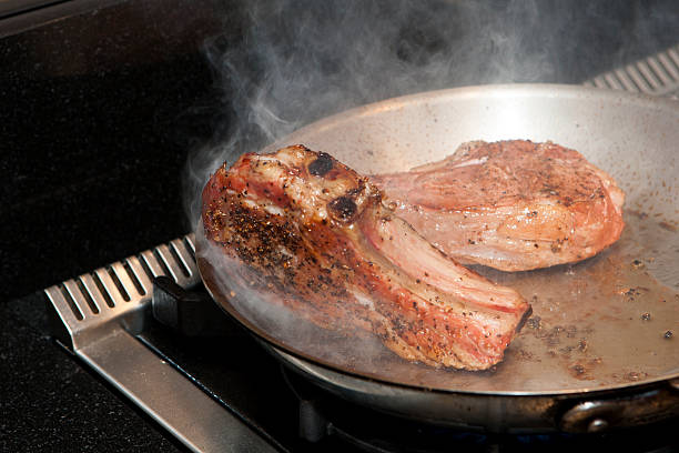 smouldering beef rib steak stock photo