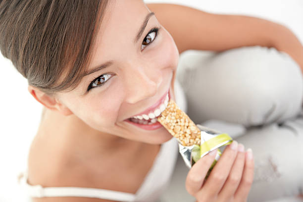 Snack eating woman stock photo