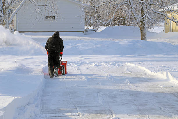 Snow Blowing the driveway stock photo