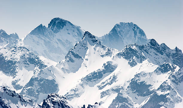 Snow covered mountains in the Alps stock photo