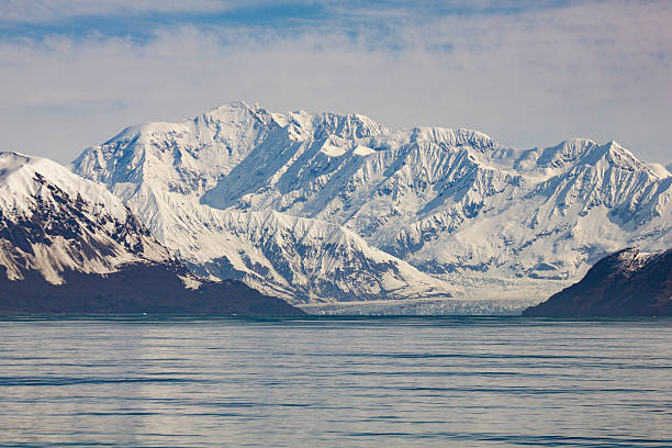 Snow Covered Mountains Near Hoonah Alaska stock photo
