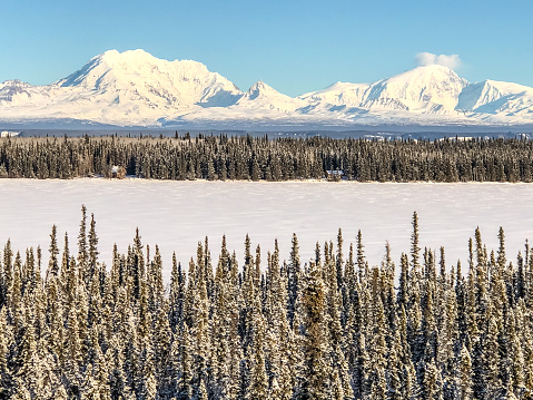 Interior Alaska is a land full of many scenic views.  During the winter season  the frozen lake and snow covered mountains created a majestic landscape.