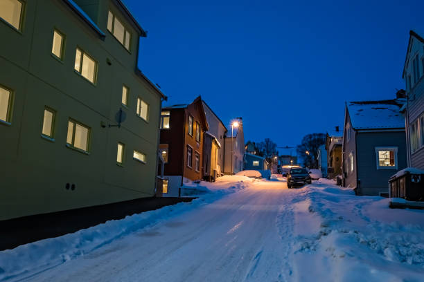 Snow covered residential sroad in Tromso stock photo