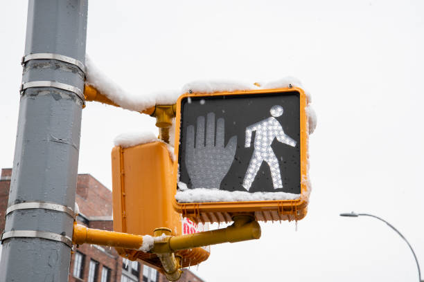 Snow in the pedestrian sign stock photo
