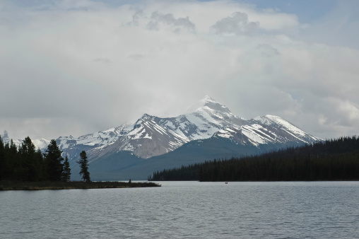 snow mountain and calm lake