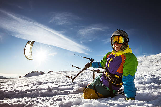 snowboarder skydives on blue sky backdrop in mountains snowfall - kemerovo imagens e fotografias de stock