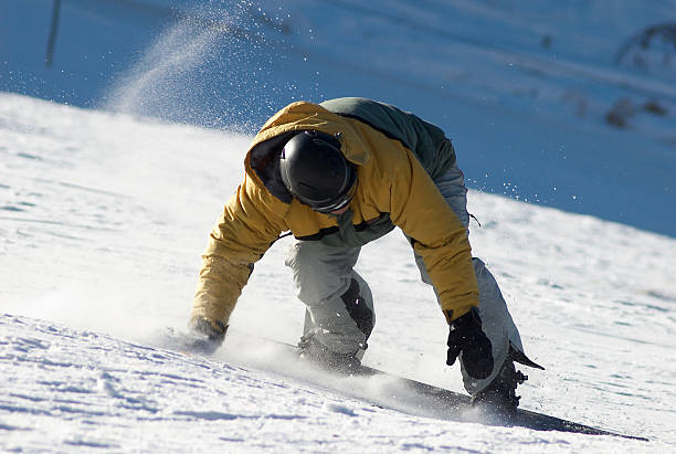 Snowboarder turn on ski slope stock photo