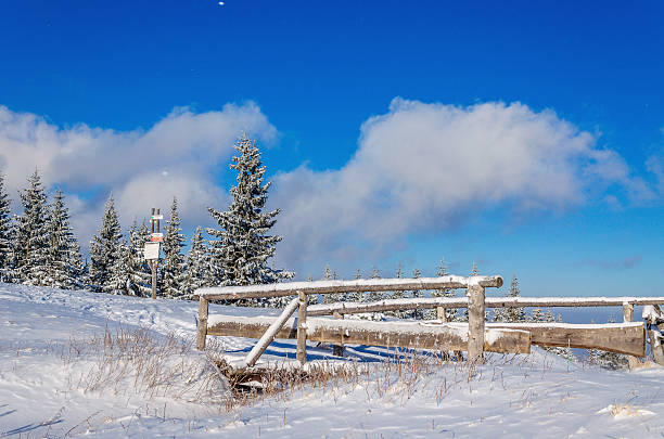 Snow-covered bridge on the tourist trail stock photo