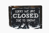 istock Snow-covered chalkboard reading Closed due to snow. Winter weather concepts. 465510208