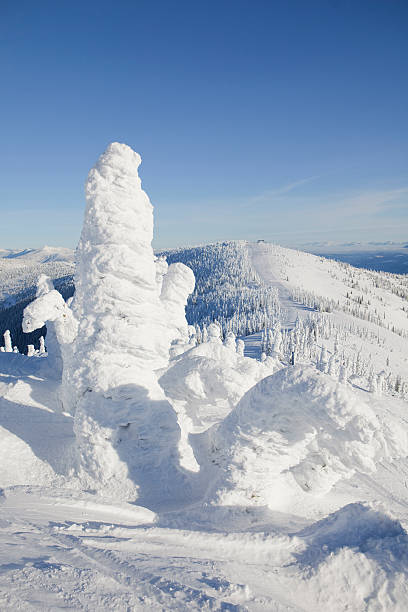Snowghosts on ridge at a ski resort stock photo