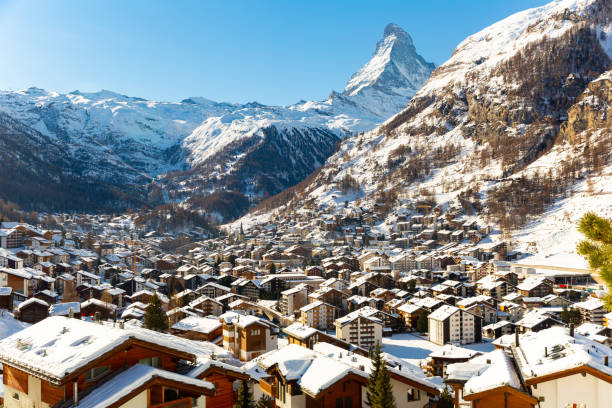 Snowing in Zermatt traditional Swiss ski resort under Matterhorn stock photo