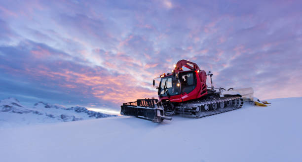 Snowplow machine at snowy ski resort stock photo
