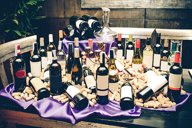 so many wine bottle and cork on the table stock photo
