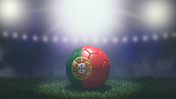 soccer ball in flag colors on a bright blurred stadium background. portugal - portugal flag stadium imagens e fotografias de stock