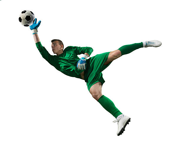 Soccer goalkeeper isolated Isolated on white professional football goalkeeper in action. The player is wearing unbranded soccer uniform. goalie stock pictures, royalty-free photos & images