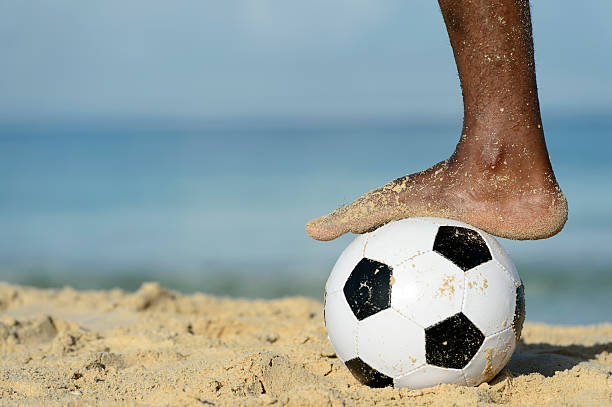Soccer On The Beach stock photo
